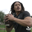 an athlete throwing a football